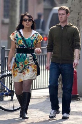 Facebook CEO Mark Zuckerberg and his girlfriend Priscilla Chan walk near Fuxing Road in Shanghai in March.