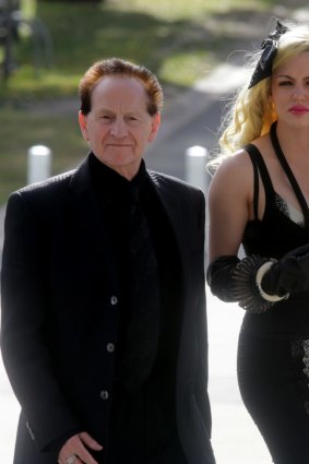 Paying respects: Geoffrey Edelsten and Gabi Grecko at the funeral of AFL great Tom Hafey at the MCG.