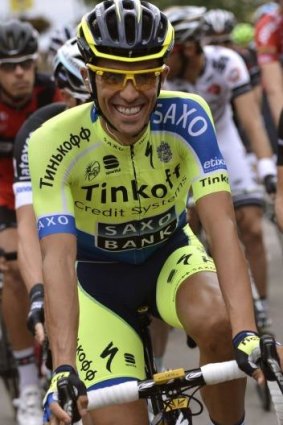 Smiling assassin: Alberto Contador before the start of the eighth stage of the Tour de France.
