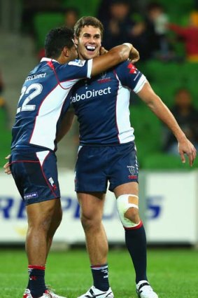Rebels Kimami Sitauti and Tom English celebrate after defeating the Stormers.