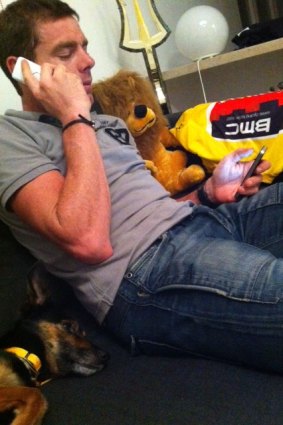 Cadel Evans gives phone interviews from his home in Switzerland in a picture posted on Twitter by his wife.