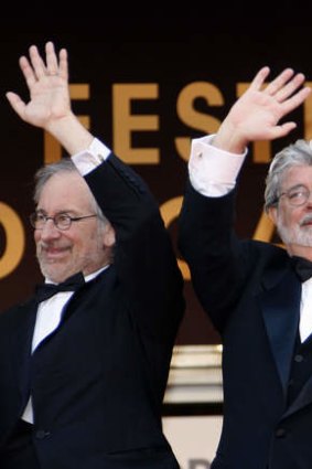 US directors Steven Spielberg, left, and George Lucas sparked a debate by warning of an "implosion" of the traditional movie industry.