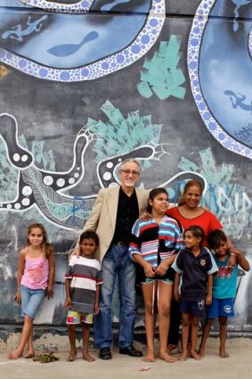 Pen power: Cuban ambassador Pedro Monzon and Cuban teacher Lucy Nunez with Aboriginal children in Bourke.