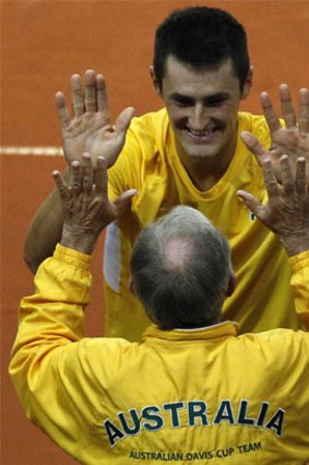 Hands up: Tony Roche with Bernard Tomic in the Davis Cup tie in Poland in September.