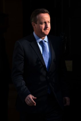 Britain's Prime Minister David Cameron  arrives at Downing Street.