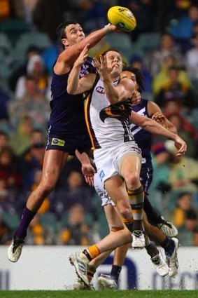 Ryan Crowley spoils Sam Mitchell during the round 19 match between Fremantle and Hawthorn in Perth.