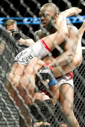 Jon Jones, top, drops Vitor Belfort on his head as he attempts to escape a Belfort armbar attempt during the light heavyweight championship title bout at UFC 152 in Toronto.