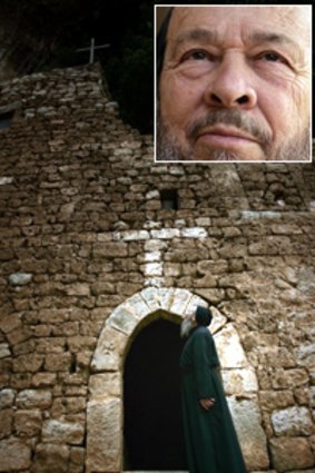 Solitary ... Father Dario Escobar outside his abode in Lebanon; and smiling serenely (inset).