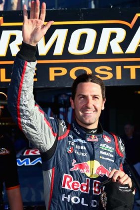 Jamie Whincup celebrates after taking pole position.