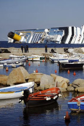 The Giglio harbour behind the Costa Concordia.