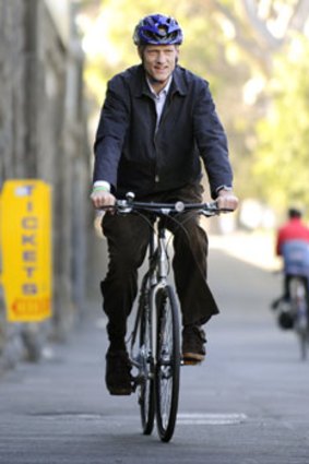 On your bike...Peter Garrett is peddling a more local message. Photo: Pat Scala.