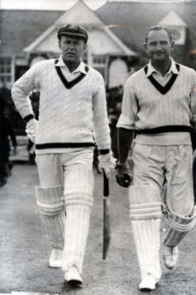 Troubled genius: Sid Barnes (right) heads out to bat with Arthur Morris.