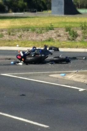 The damaged motorbike at the site of the deadly crash.