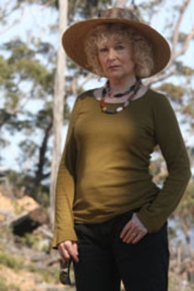 Former fashion designer Prue Acton in a recently logged area in the NSW State Forest.