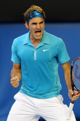 Roger Federer celebrates after coming back against Nikolay Davydenko.