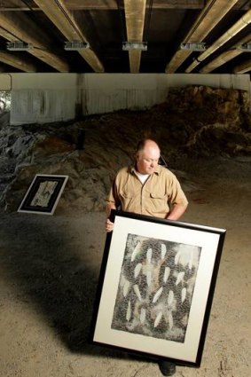 Robert Lee with his artworks at the site of the Art at Burnley Harbour exhibition.