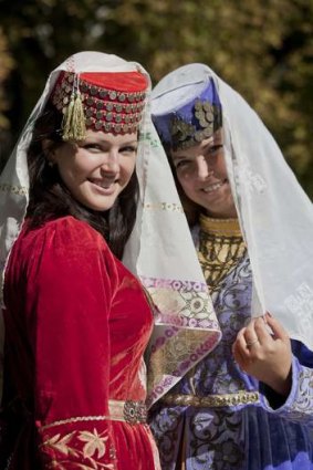 Tourists in traditional 'harem' attire at Bakhchisaray, Ukraine.