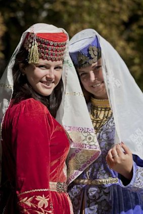 Tourists in traditional 'harem' attire at Bakhchisaray, Ukraine.