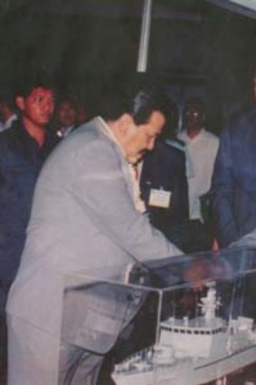 Inspection ... president Joseph Estrada (left) with Tennix executives.