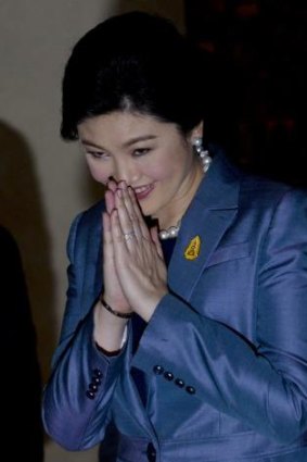 Thailand's Prime Minister Yingluck Shinawatra arrives at the Constitutional Court in Bangkok, Thailand, on Tuesday, May 6, 2014.