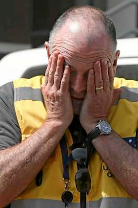 Head of Australian Federal Police mission Commander Brian McDonald touches his face after returning to Donetsk.