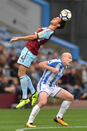 Stalemate: Aaron Mooy gets out of the way of Burnley's Jack Cork.