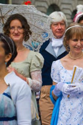 Jane Austen Festival ... ladies in Regency costume promenade through Bath. Photo: Alamy