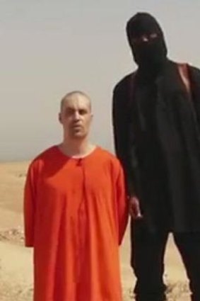 Kneeling in the sand: The footage, released on social media by Islamic State militants.