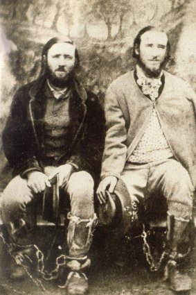 Thomas and John Clarke posed for a series
of photos in Braidwood Gaol wearing leg irons and holding their
cabbage-tree hats. John is on the right with his coat draped over his
wounded left shoulder.
