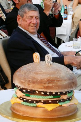 Jim Delligatti behind a Big Mac birthday cake at his 90th birthday party. 