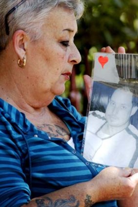 Steven Quire's mother holds a photo of her dead son.