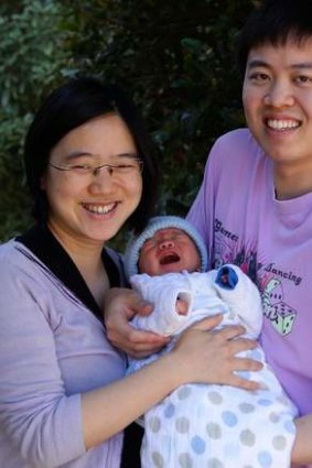 Moving up: Samuel and Sherry Chua with one-week-old Elijah.