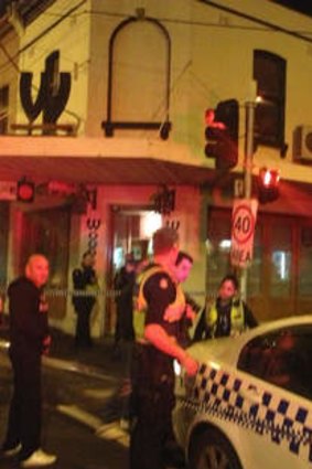 Police outside Woodstock Pizzicheria in Brunswick East.