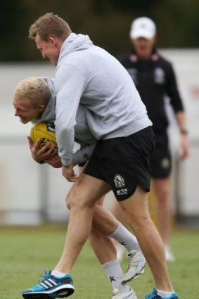 Jack Frost in action at training with coach Nathan Buckley.
