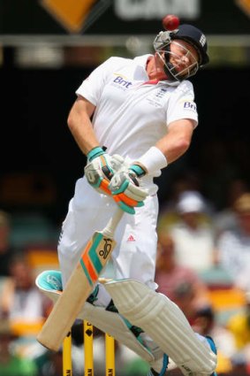 Ian Bell of England jumps as he evades a short pitched ball from Mitchell Johnson during the First Ashes Test at The Gabba.