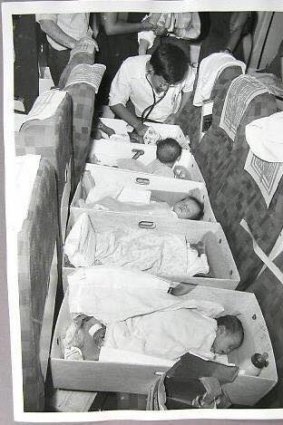 Infants on a flight to Australia from Vietnam in 1975 as part of Operation Babylift. Canberra man Rohan Samara jokes he is the baby on its stomach looking around thinking "where the hell am I?'' but he's not exactly sure which baby he was.