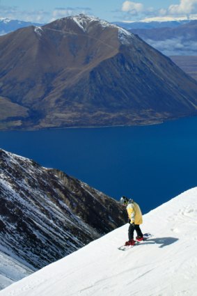 Snowed in ... snowboarding with Lake Ohau in the background.