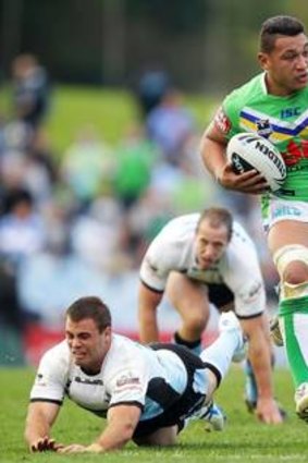 John Papalii makes a break during the round 20 NRL match between the Cronulla Sharks and the Canberra Raiders at Toyota Stadium.