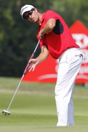 Adam Scott ... has defended the use of his long putter.