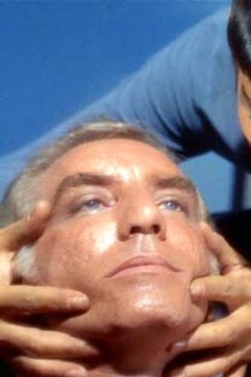 Spock performs a "mind meld" in <em>Star Trek</em>.