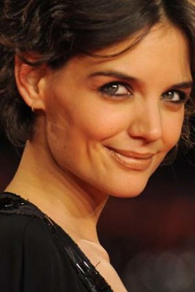 Katie Holmes exfoliates her skin for a smooth surface.