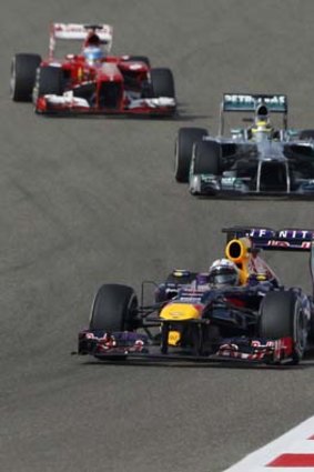 Red Bull driver Sebastian Vettel leads Mercedes' Nico Rosberg and Ferrari's Fernando Alonso in the Bahrain F1 Grand Prix.