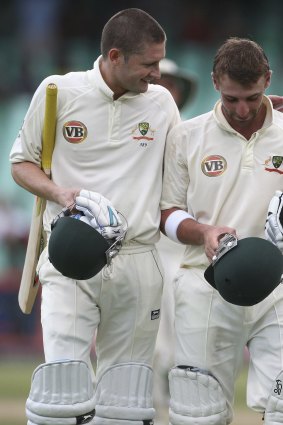 The pair leave the field in Durban in 2009. 