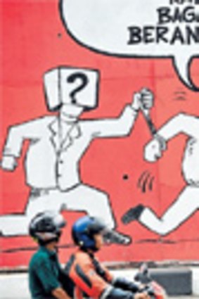 A cartoon on a Jakarta street reads "If it's going like this, then how to eradicate corruption?"