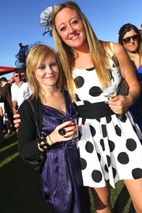 Hannah Culley and Luisa Carter enjoy the lively atmosphere of Doomben.
