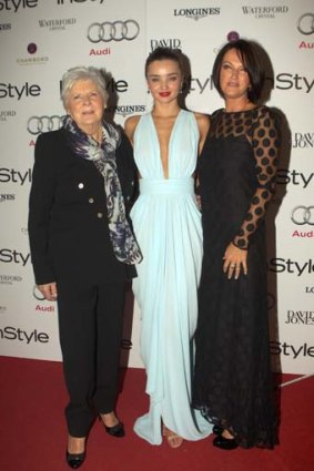 Dressed to impress &#8230; Miranda Kerr, centre, with her grandmother Anne, left, and her mother, Therese.