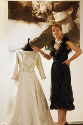 Darcey Bussell poses with Audrey Hepburn's ivory satin wedding gown.