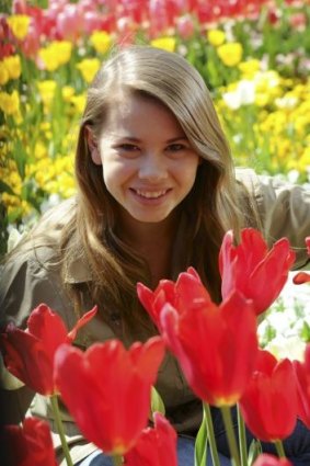Bindi Irwin poses in a garden bed at Floriade. 