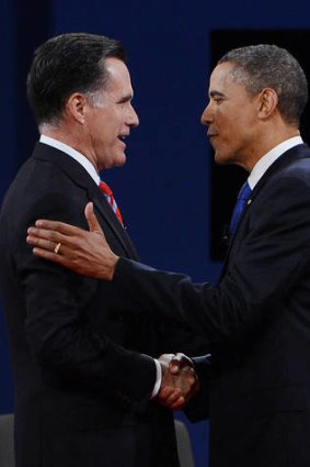 Making friends ...  Barack Obama and  Mitt Romney arrive on stage for the third presidential debate  in Boca Raton.