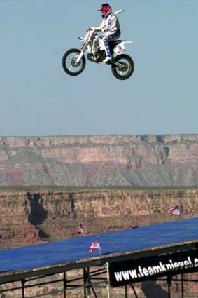 Robbie Knievel jumps the Grand Canyon on a motorcycle in  May 1999.